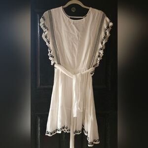 White Ruffled Dress with Black Embroidery